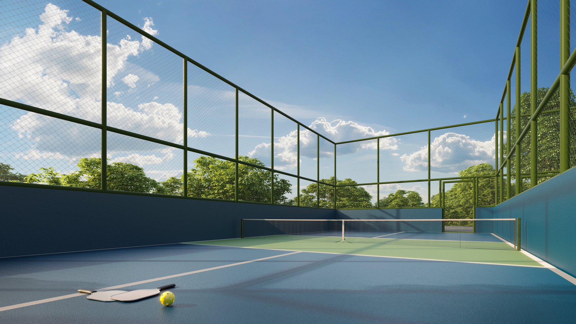 Quadra de pickleball com piso azul e cercamento lateral